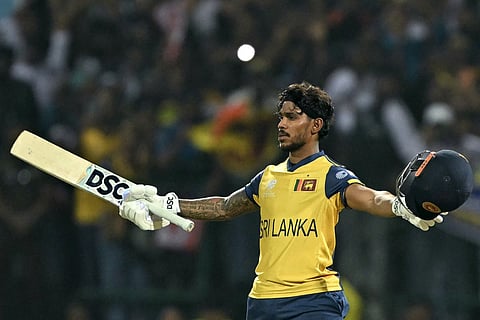 Sri Lanka's Pathum Nissanka celebrates after scoring a century (100 runs) during the 2026 ICC Men's T20 Cricket World Cup group stage match between Australia and Sri Lanka at Pallekele International Cricket Stadium in Kandy on February 16, 2026.