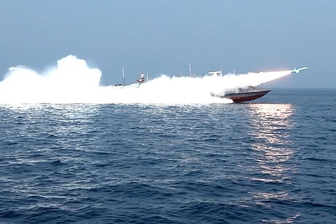This handout photo released by Iran's Revolutionary Guards Corps (IRGC)'s official website Sepanews on February 17, 2026, shows a rocket being fired from a boat during a military exercise by members of the IRGC and navy in the Strait of Hormuz.