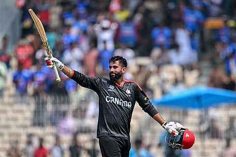 Canada's Yuvraj Samra celebrates after scoring a century (100 runs) during the 2026 ICC Men's T20 Cricket World Cup group stage match between Canada and New Zealand at the MA Chidambaram Stadium in Chennai on February 17, 2026.