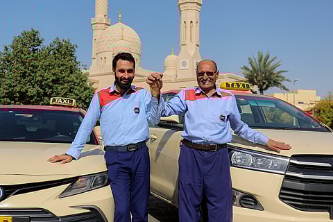 Father Umar Zarin and son Waqas Khan, Pakistani father-son duo serving Dubai Taxi Company.
