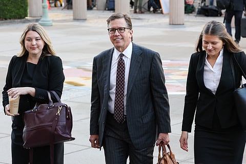 Mark Lanier (C), attorney for the plaintiffs, arrives at Los Angeles Superior Court ahead of the social media trial tasked to determine whether social media giants deliberately designed their platforms to be addictive to children, in Los Angeles, on February 18, 2026.