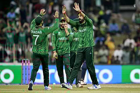 Pakistan's Usman Tariq (R) celebrates with Shadab Khan (L) and captain Salman Agha after their team's victory against Namibia at the end of their 2026 ICC Men's T20 Cricket World Cup group stage match in the Sinhalese Sports Club (SSC) Ground, Colombo on February 18, 2026.