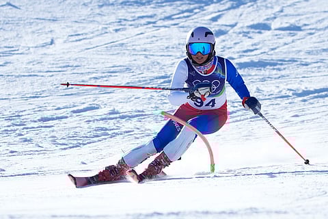Philippine's Tallulah Proulx speeds down the course during an alpine ski, women's slalom race, at the 2026 Winter Olympics, in Cortina d'Ampezzo, Italy, Wednesday, Feb. 18, 2026