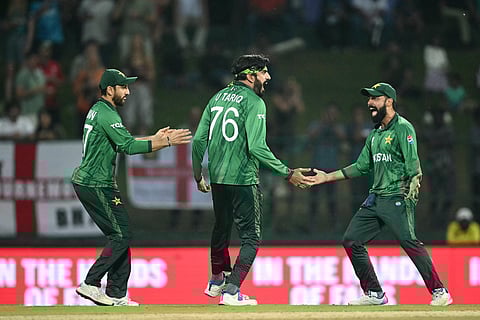 Pakistan's Usman Tariq (C) celebrates with teammates after taking the wicket of England's Tom Banton during the 2026 ICC Men's T20 Cricket World Cup Super Eights match between England and Pakistan at the Pallekele International Cricket Stadium in Kandy on February 24, 2026.