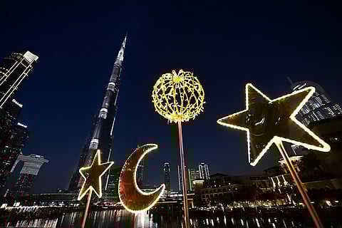 Crescent-shaped festive decorations are pictured near Burj Khalifa in the centre of Dubai on February 24, 2026 during the Muslim holy fasting month of Ramadan.