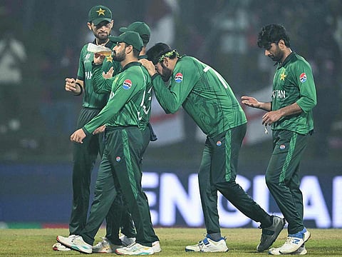 Pakistan players walk back after their defeat during the T20 World Cup Super Eights match against England at the Pallekele International Cricket Stadium in Kandy on February 24, 2026.