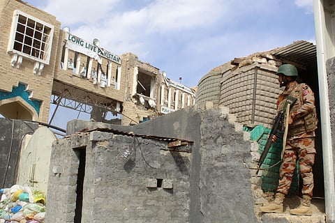 A Pakistani soldier stands guard at the Pakistan-Afghanistan border in Chaman on February 27, 2026, following overnight cross-border firing between the two countries.