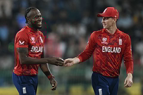 England's captain Harry Brook (R) and teammate Jofra Archer interact during the 2026 ICC Men's T20 Cricket World Cup Super Eights match between England and New Zealand at the R Premadasa Stadium in Colombo on February 27, 2026.