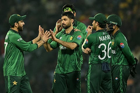 Pakistan's Abrar Ahmed (2L) celebrates with captain Salman Agha (L) and teammates after taking the wicket of Sri Lanka's Charith Asalanka during the 2026 ICC Men's T20 Cricket World Cup Super Eights match between Sri Lanka and Pakistan at the Pallekele International Cricket Stadium in Kandy on February 28, 2026.