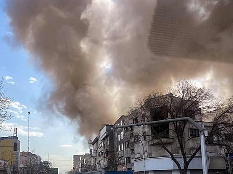 Smoke billows following the pre-emptive strike from Israel and the United States, in Tehran on Saturday.