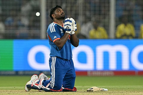 India's Sanju Samson prays as he celebrates his team's win against West Indies at the end of their 2026 ICC Men's T20 Cricket World Cup Super Eights match in the Eden Gardens, Kolkata on March 1, 2026.