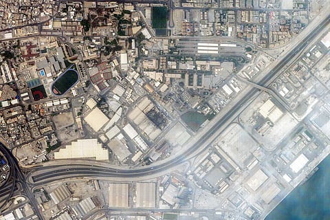 This handout satellite image taken by 2026 Planet Labs PBC on March 1, 2026 shows a view of smoke rising from damage at the US Fifth fleet naval base in Bahrain's capital Manama after it was hit by Iranian strikes.