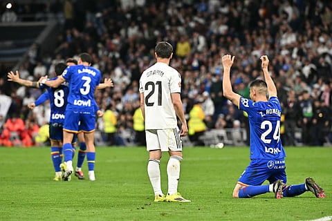 Getafe's Argentine defender #24 Zaid Romero and teammates celebrate their victory at the end of the Spanish league football match between Real Madrid CF and Getafe CF at Santiago Bernabeu Stadium in Madrid on March 2, 2026.