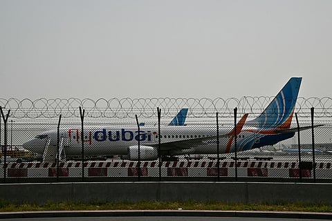 A flydubai plane is parked on the tarmac at Dubai International Airport as Iran retaliates following the US and Israel’s assassination of its supreme leader.