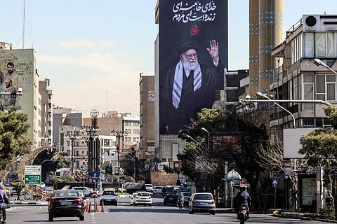 A billboard of Iran’s slain supreme leader Ayatollah Ali Khamenei reading in Persian "His God is still alive" in Tehran on March 3, 2026.