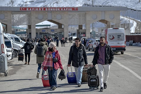 Iranian nationals arrive in Turkey after passing through the Razi-Kapiköy border crossing in Van, north-eastern Turkey, on March 3, 2026, a day after Turkey and Iran have mutually suspended day-trip crossings at their border as Israeli-US strikes continued to pound the Islamic Republic.