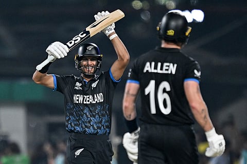 New Zealand's Rachin Ravindra (L) and Finn Allen celebrate their team's win at the end of the 2026 ICC Men's T20 Cricket World Cup semi-final match between New Zealand and South Africa in the Eden Gardens of Kolkata on March 4, 2026.