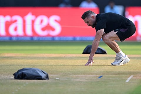 England’s head coach Brendon McCullum checks the pitch during a training session on the eve of their 2026 ICC Men's T20 Cricket World Cup semi-final match against India at the Wankhede Stadium in Mumbai on March 4, 2026.