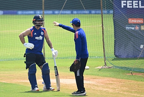 India's Rinku Singh (L) listens to coach Gautam Gambhir (R) during a training session ahead of the 2026 ICC Men's T20 Cricket World Cup’s semi-final match between India and England at the at the Wankhede Stadium in Mumbai on March 4, 2026.