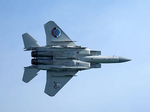 A Qatar Emiri Air Force F-15 Eagle tactical fighter aircraft performs aerial maneuvers in the sky above Doha as Qatar marked its National Day on December 18, 2021.