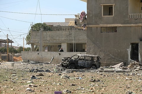 A man stands next to the destruction at the site of an overnight Israeli airstrike that targeted the village of Douris, near Baalbeck in Lebanon's Bekaa valley is seen on March 6, 2026.