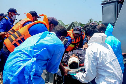This photograph taken on March 4, 2026 and released by the Sri Lankan President's Office on March 6, 2026 shows Sri Lankan navy personnel evacuating rescued Iranian sailors from the IRIS Dena frigate after a US submarine attack off Sri Lanka's southern coast in Galle.