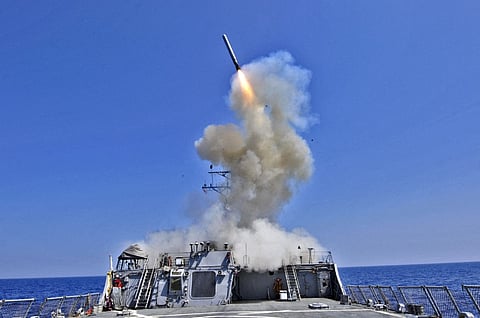 In this handout released by the US Navy, the US Navy guided-missile destroyer USS Barry (DDG 52) launches a Tomahawk cruise missile in support of Operation Odyssey Dawn March 29, 2011 from the Mediterranean Sea..