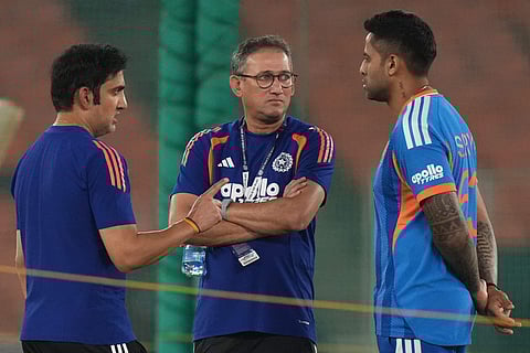 India's head coach Gautam Gambhir, left, Chief Selector Ajit Agarkar, center, and India's captain Suryakumar Yadav talks during a practice session ahead of the T20 World Cup cricket final match against New Zealand in Ahmedabad, India, Saturday, March 7, 2026.