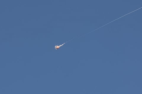 Rocket trails are seen in the sky above the Israeli coastal city of Tel Aviv amid a fresh barrage of Iranian missile attacks. File photo taken on March 9, 2026.