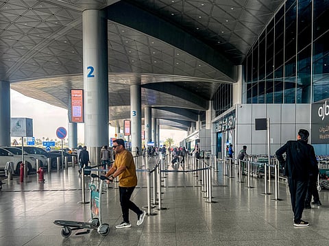 Travellers outside the terminal at King Khalid International Airport in Riyadh
