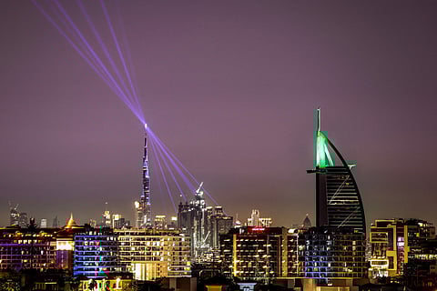 The Burj Khalifa skyscraper (L), the world’s tallest building, and the Burj al-Arab hotel (R) are pictured along the Dubai skyline on March 11, 2026.