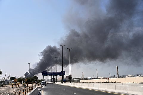Smoke rises after an Iranian drone attack in the port area of Dubai, United Arab Emirates, Sunday, March 1, 2026. (AP Photo/Fatima Shbair)