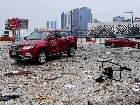 A photograph shows the damage in the aftermath of a drone strike in the Seef district of Manama on March 10, 2026.