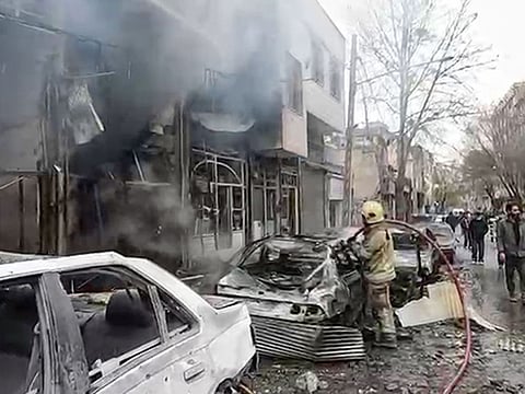Firefighting operations are underway after the US-Israeli attacks in an area in Tehran on Wednesday, March 11, 2026.