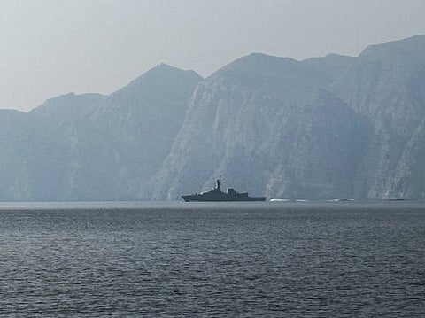 A navy vessel is seen sailing in the Strait of Hormuz, a vital waterway through which much of the world's oil and gas passes on
