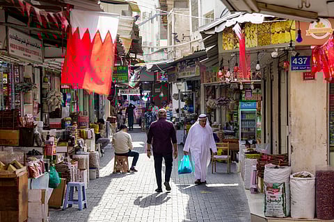 People walk along an alley at a bazaar in Bahrain's capital Manama on March 11, 2026.