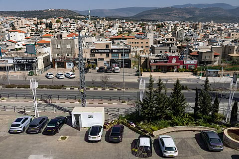 A bomb shelter is seen within a public parking space in the Arab town of Sakhnin in northern Israel near the Lebanese border on March 12, 2026.