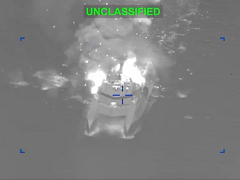 A screengrab from a video shared by the US Central Command showing an Iranian combat ship up in flames after being hit in a precision strike. American Admiral Brad Cooper said "strike waves" were carried out nearly every hour from different locations and directions going into Iran.