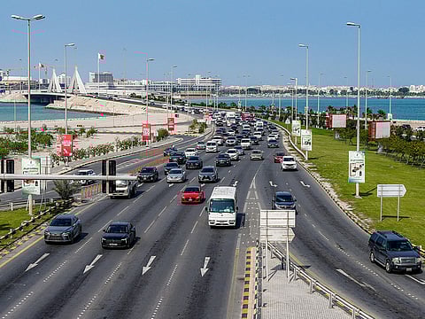 Vehicles move on a highway by the Muharraq Bridge in Bahrain's capital Manama.