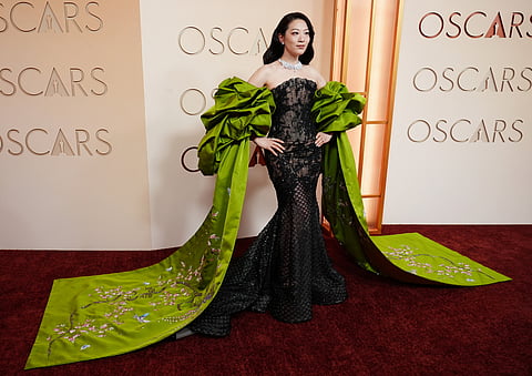 Arden Cho arrives at the Oscars on Sunday, March 15, 2026, at the Dolby Theatre in Los Angeles. (Photo by Richard Shotwell/Invision/AP)