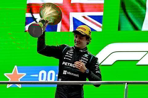 Winner Mercedes' Italian driver Kimi Antonelli celebrates on the podium after the Formula One Chinese Grand Prix at the Shanghai International Circuit in Shanghai on March 15, 2026.
