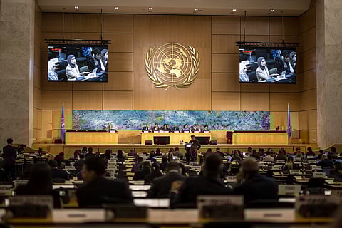 A Gulf representative is seen on screens as he delivers a speech on human rights in the Islamic Republic of Iran during a session of the UN Human Rights Council, in Geneva on March 16, 2026.