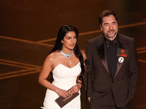 Indian actress Priyanka Chopra and Spanish actor Javier Bardem present the award for Best International Feature Film onstage during the 98th Annual Academy Awards at the Dolby Theatre in Hollywood, California on March 15, 2026.