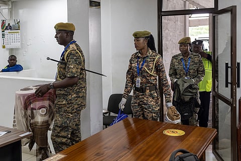 Kenya Wildlife Services wardens deliver exhibits of live ants confiscated from Chinese national, Zhan Kequn and his co-accused Kenyan, Charles Mwangi (both not in picture) to the Jomo Kenyatta International Airport (JKIA) law courts, before the accused arraignment to take a plea against charges of dealing in wildlife species contrary to laws regulating wildlife conservation after they we're found in possession of more than two thousand live ants intended to be trafficked internationally in Nairobi on March 17, 2026.