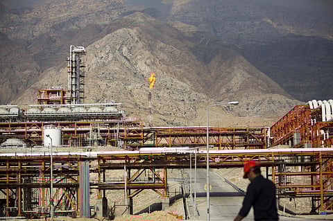 An Iranian walks along the phase 15-16 of the South Pars gas field facilities in the southern Iranian port of Assaluyeh on the shore of the Gulf.