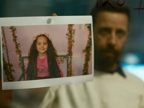 The image shows Motaz Malhees in a scene from 'The Voice of Hind Rajab.'