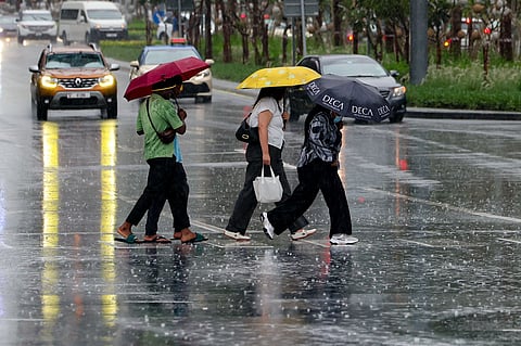 UAE rain in photos: Residents brave wet streets amid unstable weather