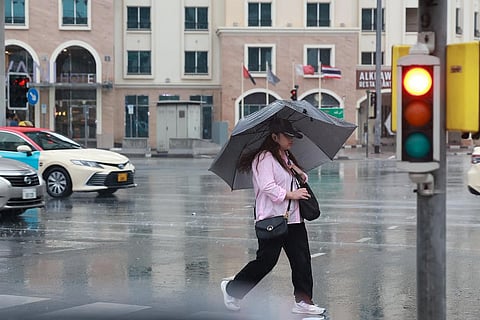 Residents experience rainfall in Al Muraqabat, Dubai.