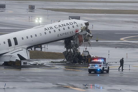An Air Canada Express CRJ-900 sits on the runway after colliding with a Port Authority fire truck at LaGuardia Airport in New York, on March 23, 2026.