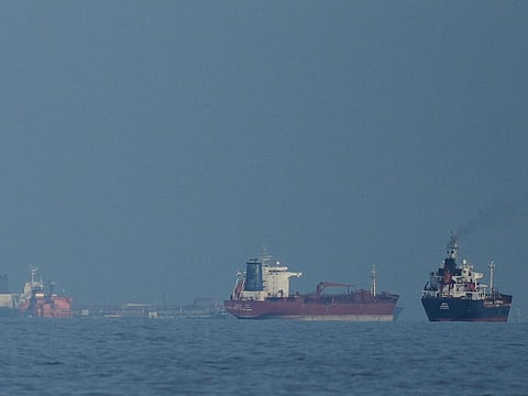 Oil tankers and cargo ships line up in the Strait of Hormuz.